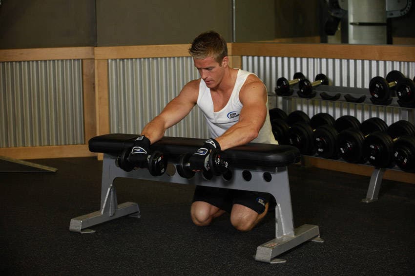 Palms-Down Dumbbell Wrist Curl Over A Bench, start